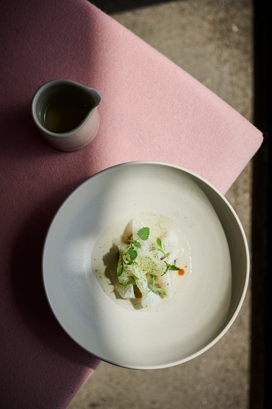 food photograph of fine dining dish on pink surface